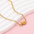 Gold Abstract Ribbon Necklace with Pear-Cut Stone